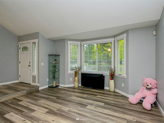 Front Entry/Living Room. Flows nicely with open concept design and tall ceilings.