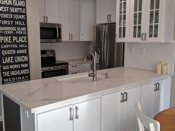 Kitchen cabinets on the back side of the peninsula.