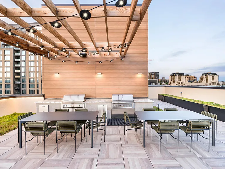 Gather friends and fire up the grill at Modera Golden Triangle's rooftop grilling area, offering breathtaking panoramic views of Denver.
