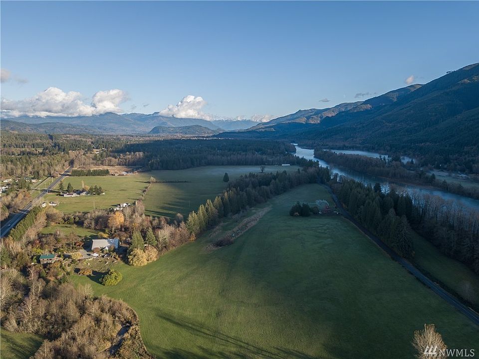 This magnificent property is one of kind... Acres of gardens, forest, pasture, fruit trees, farmland, low bank river and creek frontage. Custom built home with views from every window and huge barn with endless possibilities.