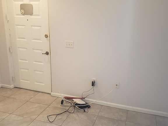 Living room facing front door. Front patio on the right