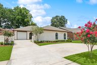 Beautiful curb appeal and plenty of parking with a straight and circle driveway.