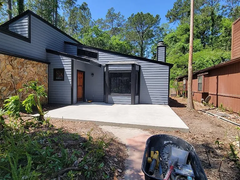 Completely renovated building/concrete patio ready for your outdoor umbrella/and table