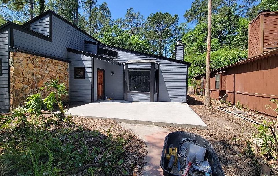 Completely renovated building/concrete patio ready for your outdoor umbrella/and table