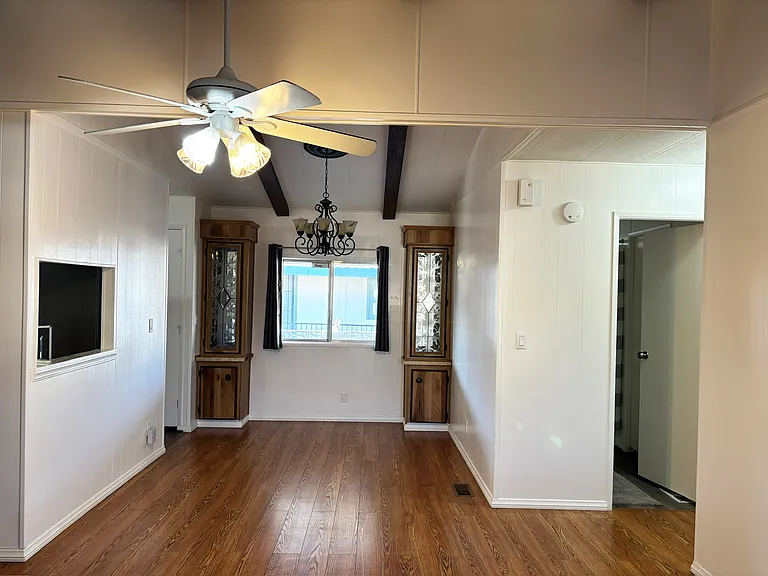 Dining room has opening to kitchen where you can pass thing through. Great when you have a lot of guests.