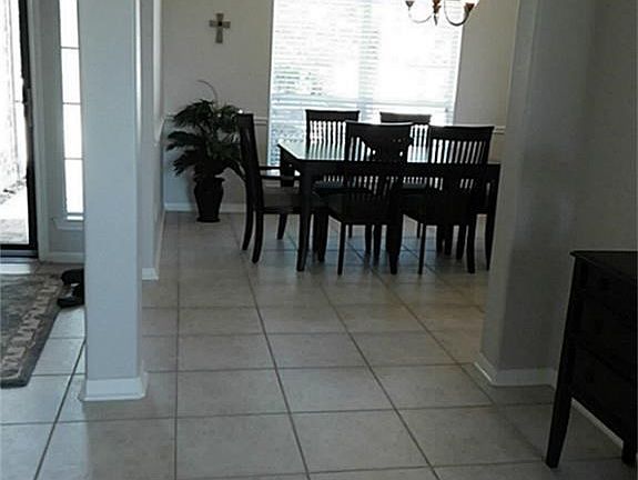 This View Is Looking Towards The Formal Dining And The Front Entry Is On Your Left. Notice Those Nice Unique Columns And Arch Ways And Soaring Ceilings;That Give This A Very Nice Touch
