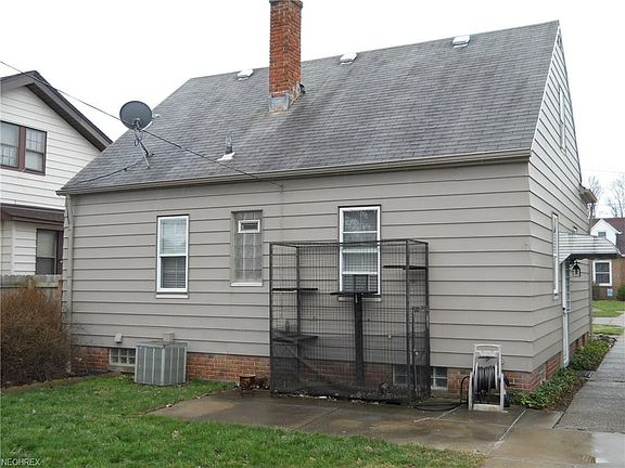 Rear of home with cat enclosure.