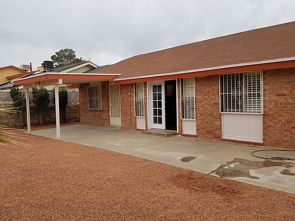 Spacious backyard with covered patio