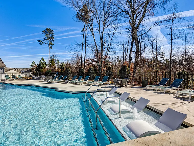 Dive into luxury at our resort-style pool with in-pool seating, where relaxation meets sophistication.
