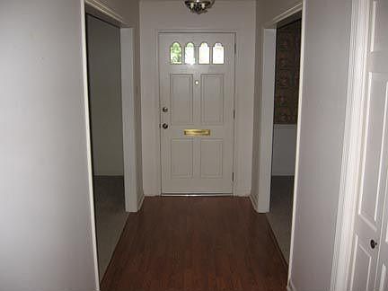 Foyer with living room and dining room on either side
