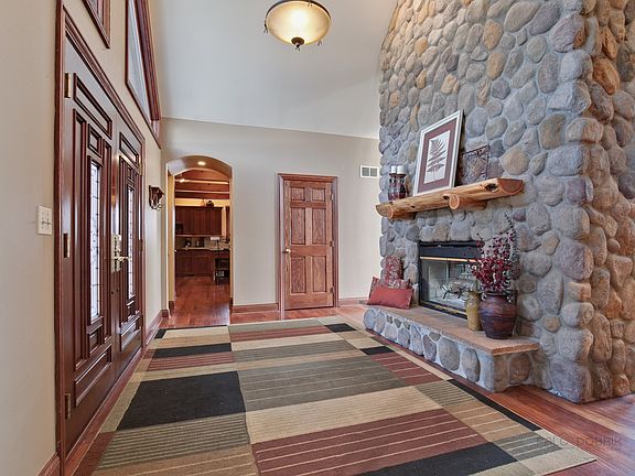 Grand Entry w/welcoming stone fireplace