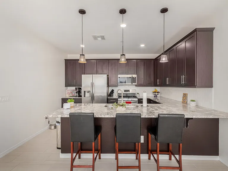 Fully stocked kitchen with cleaning supplies provided.