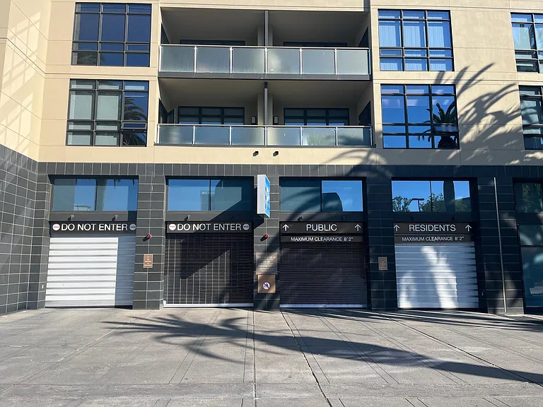 Entrance/exit to residential garage and public garage.