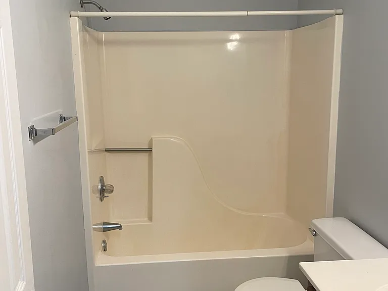The front bath has LVP flooring and a tub/shower combo.