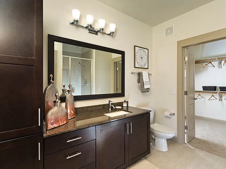 Walk-in showers with glass doors and ceramic tile surround