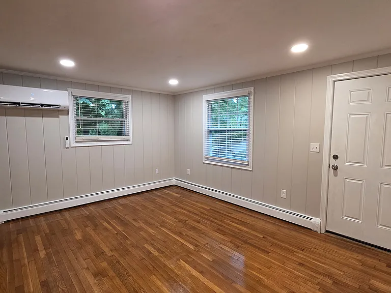 a living room; a mini split for heating and cooling