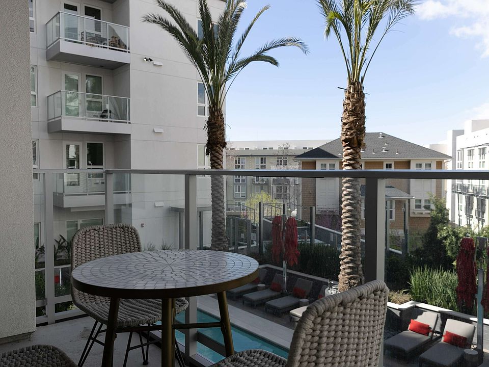 Relax outside with city views and sunny vibes.