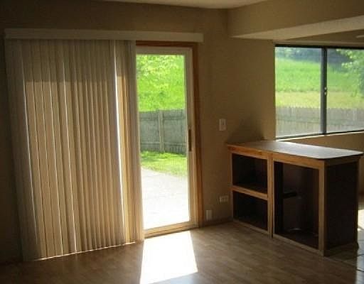 Door to the Patio, kitchen on the right