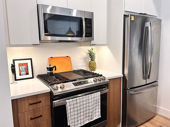 Stainless steel appliances with gas cooktop.