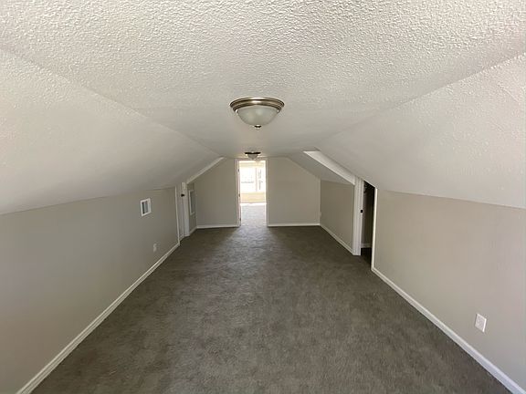 Upstairs flex space with a spacious bedroom at the back. Window unit to be installed September 2024 to help with cooling the upstairs.