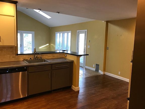 Early picture of kitchen and added den. All since painted different color.