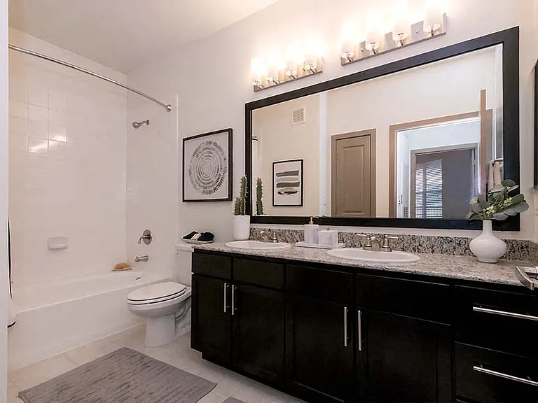 Our modern baths are complete with double vanities, framed mirrors and soaking tubs