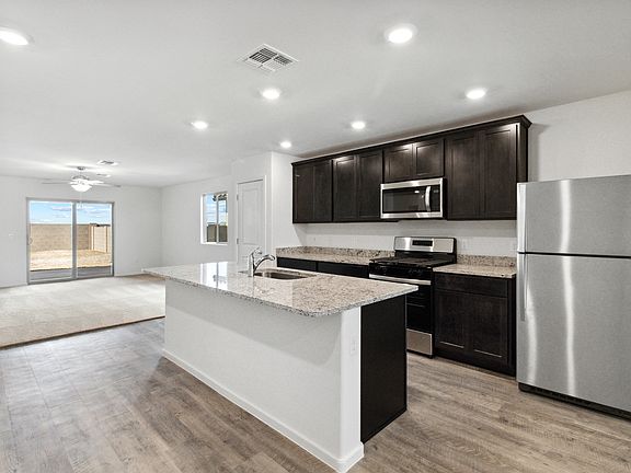 Chef-ready kitchen with large island and expansive countertop space.