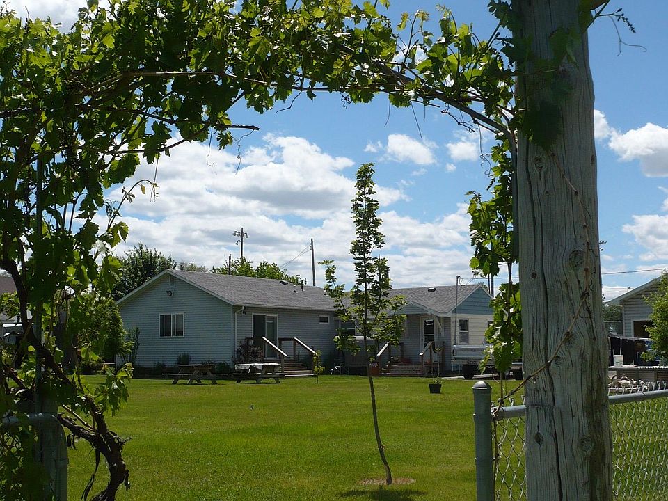 Large fenced yard with lawn care provided by owner