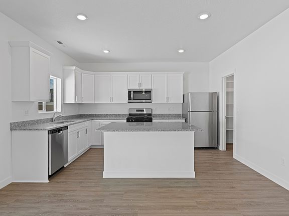 The kitchen has energy-efficient appliances.