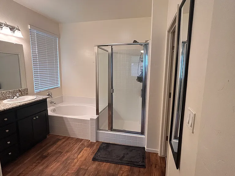 spacious master bathroom with separate tub and shower