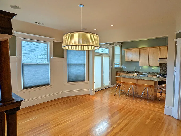 Another view of living room and kitchen