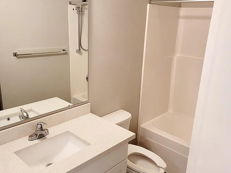 #1 Bathroom w/ stackable washer & dryer.