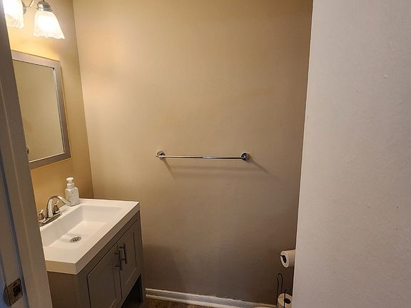 Downstairs Bathroom with new mirror and vanity