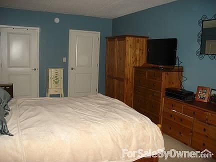 Master Bedroom : Doors pictured lead to master bathroom and walk-in closet.