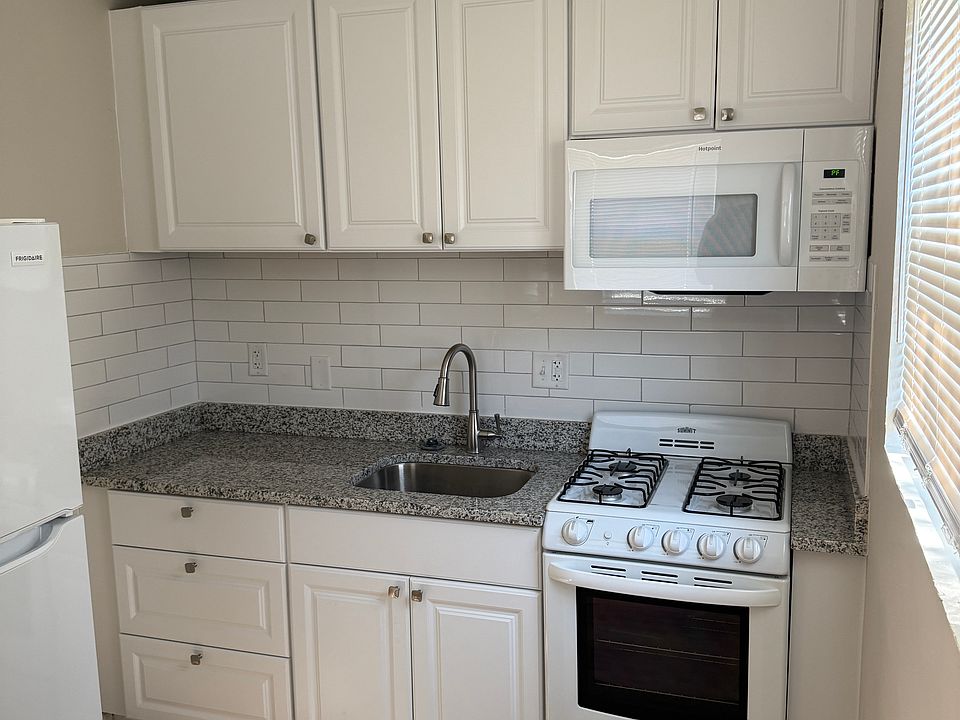 Newly renovated kitchen with new appliances, cabinets, granite countertop, and garbage disposal
