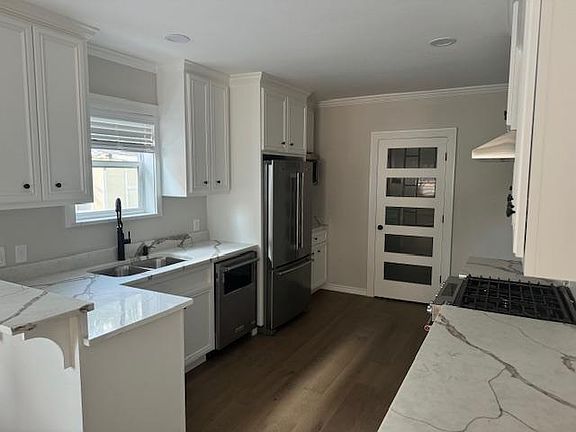 Kitchen, the door in the middle leads to the pantry/laundry/storage area
