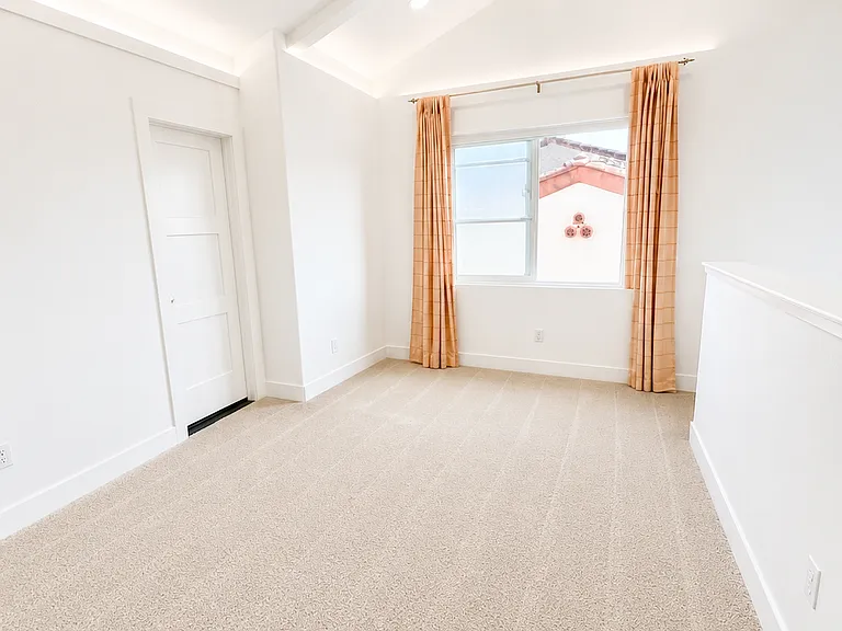 Versatile second-floor loft area ideal for a home office, media room, study space, or playroom