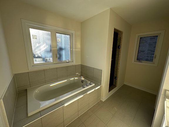 master bedroom ensuite washroom with separate shower, tub