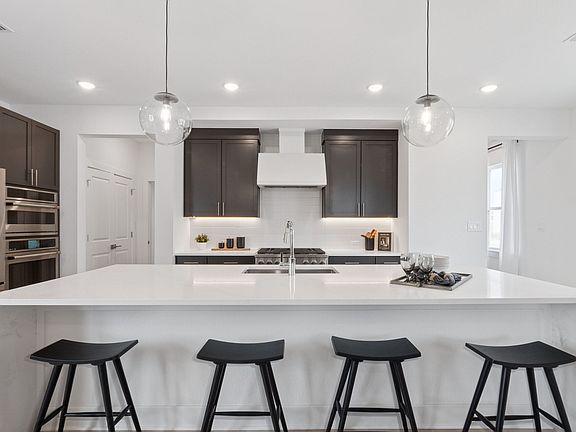 Kitchen with waterfall-edge central island