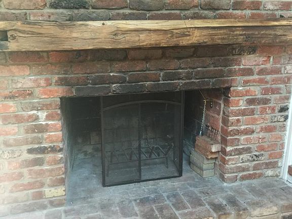 Working wood fireplace with reclaimed barn woos mantle