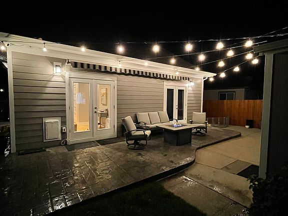 Patio lights from this pic will stay but furniture and fire pit will not.