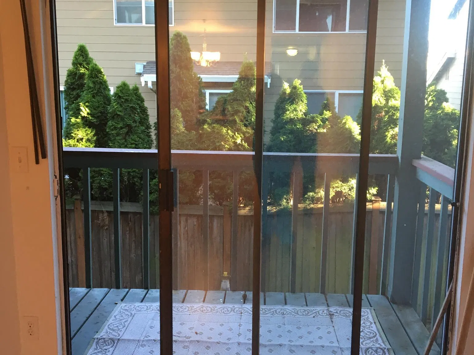 Sliding door to balcony and exterior storage.