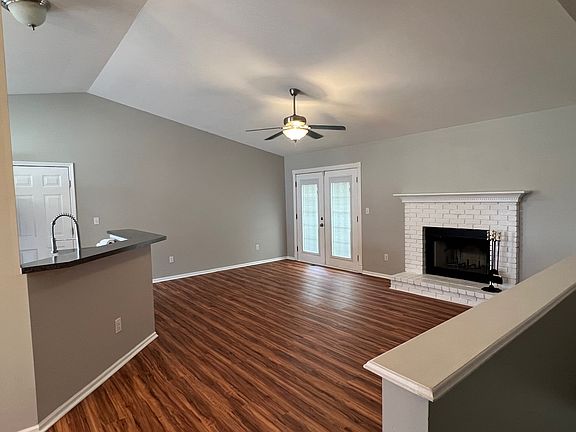 Family room with wood burning fireplace.