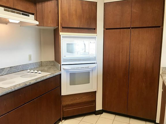 Built in oven - microwave - cook top. Lots of storage.