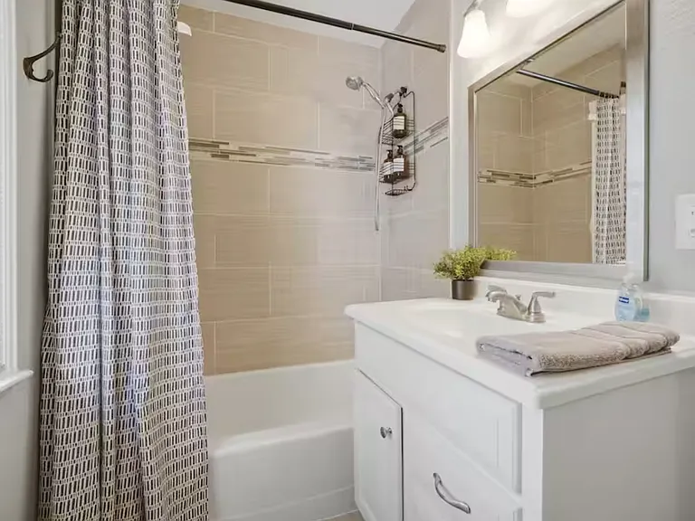 Full bathroom in upstairs hallway.