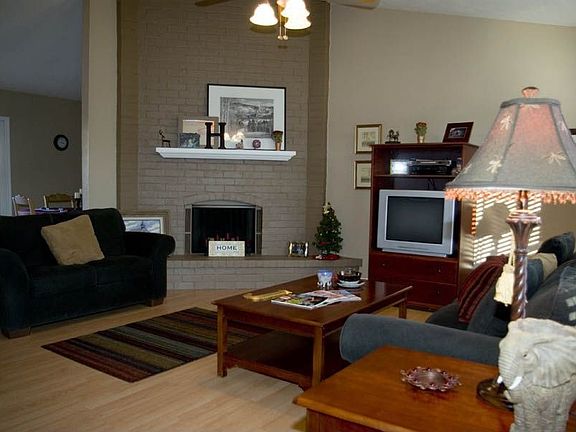 Get cozy in front of the floor to ceiling brick fireplace