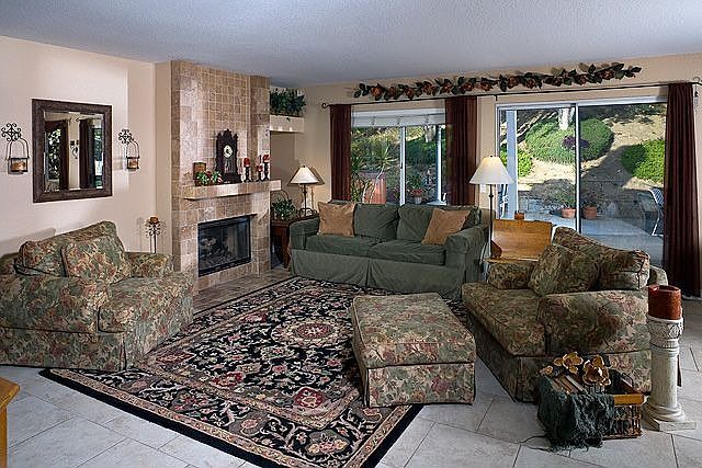Inviting family room with fireplace and built in entertainment center