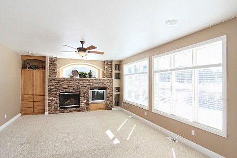 Spacious great room w/stacked stone fireplace