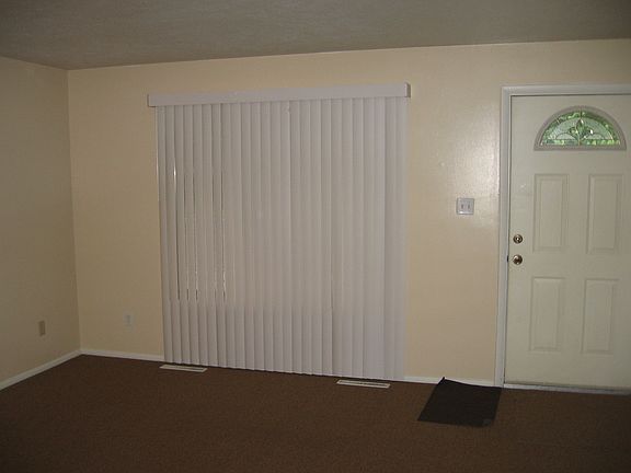 vertical blinds in living rm