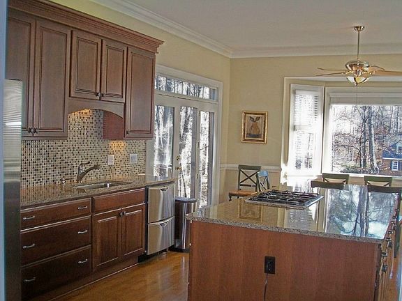 brand new cherry/granite/stainless/glass tile kitchen